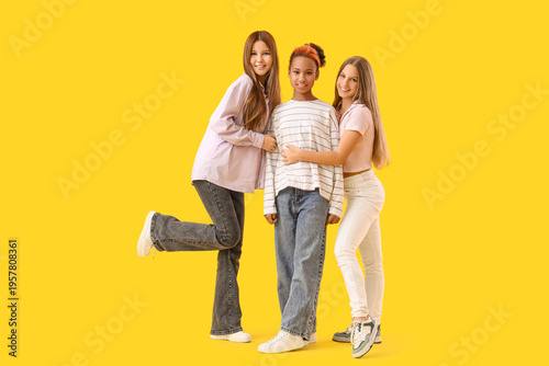 Teenage girls hugging on ye...