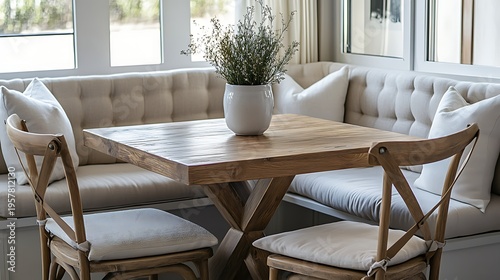 A casual breakfast nook set with cushioned chairs and a square table 