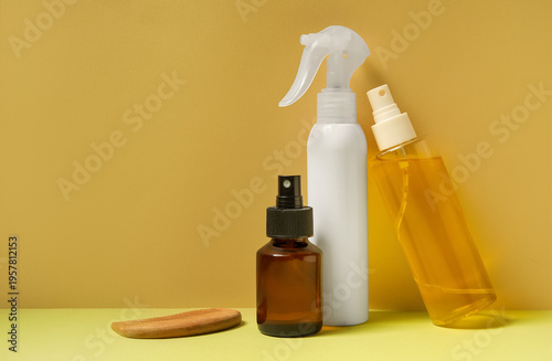Hair sprays with comb on ye...
