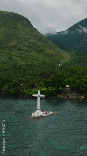 Wallpaper Mural A large Cross in turquoise sea water in Camiguin Island. Sunken Cemetery. Philippines. Vertical video. Torontodigital.ca