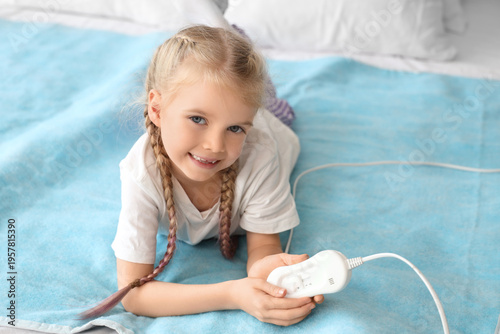 Little girl lying on electr...