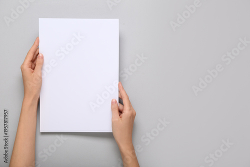 Female hands holding blank ...