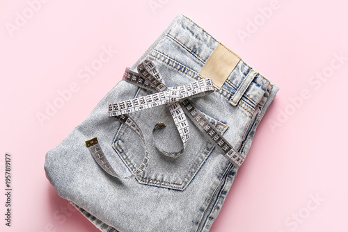 Folded denim jeans with mea...