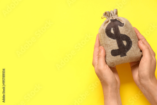 Hands with bag full of mone...