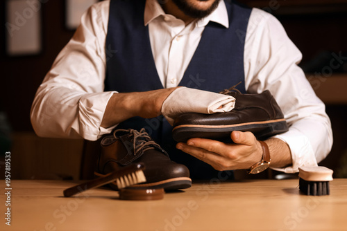 Man wiping shoe in room at ...