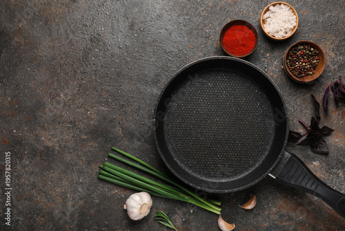 Empty frying pan with garli...