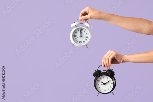Female hands with alarm clo...