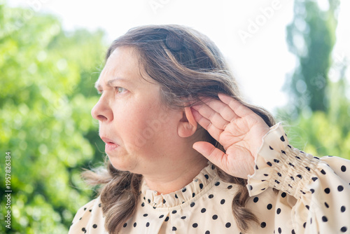 Canvas Print mature woman with expression surprise, female touching ear, ringing and auditory