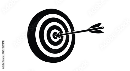 A black dart hitting the bullseye of a target a striking silhouette