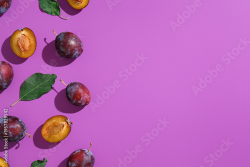 Fresh ripe plums and leaves...