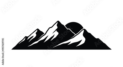 Dramatic mountain range and full moon depicted in a striking silhouette