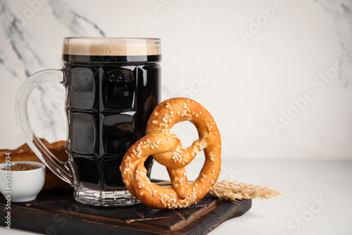 Board with mug of dark beer...