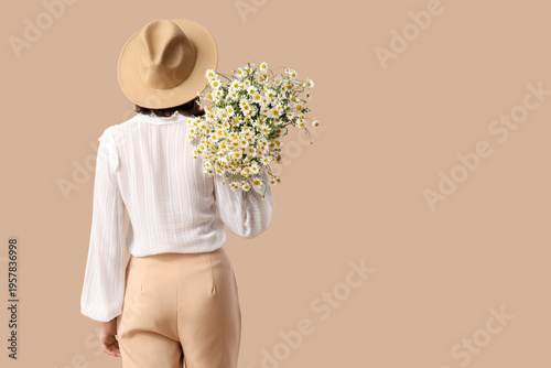 Young woman in wicker hat w...