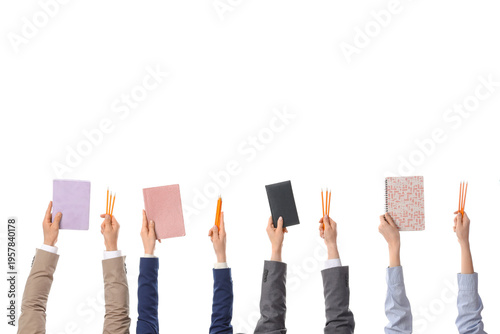 Many hands with notebooks a...