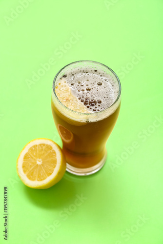 Glass of fresh beer with le...