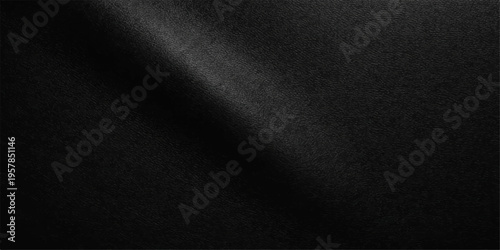 A dark macro closeup of a textured black leather and fabric material surface reveals a rough textile pattern suitable for a grunge cloth wallpaper or design backdrop