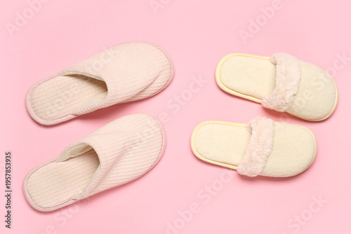 Two pairs of slippers on pi...