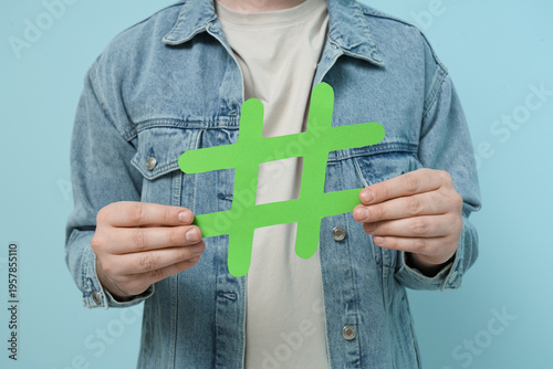 Man with hashtag sign on bl...