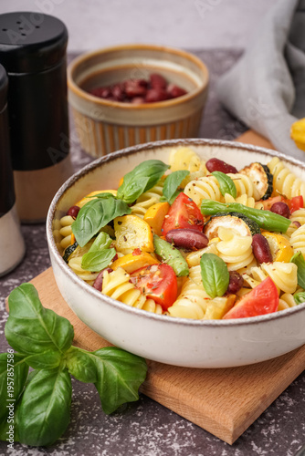 Bowl of tasty pasta salad w...