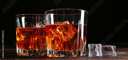 Glasses of whiskey with ice...