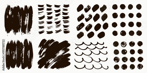 Abstract brushstrokes and ink splatters in a black and white composition