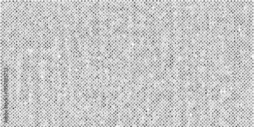 Close up of a gray textured surface resembling woven fabric or netting