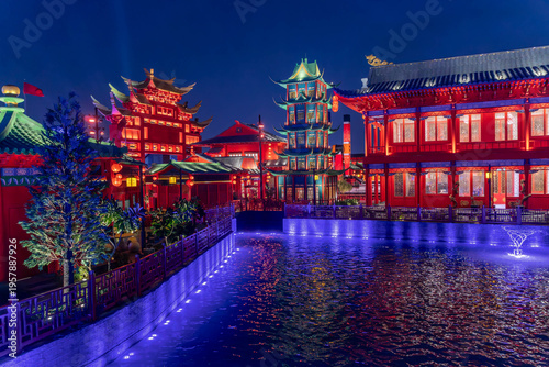 Night photo of Chinese temples with Asian pagoda in Riyadh Boulevard World, Saudi Arabia, an culture amusement park.
