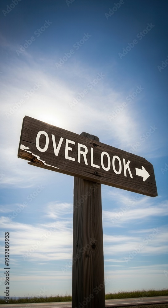 Fototapeta premium Rustic Overlook Sign Invites Exploration Under Vast Blue Sky