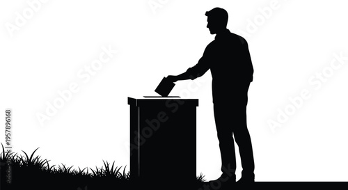Silhouette of a man depositing a ballot into a voting box