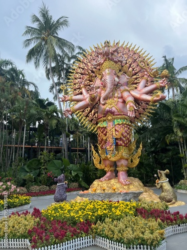 Colorful ornate ganesha statue in a tropical garden