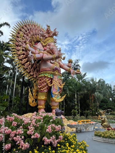 Colorful ornate ganesha statue in a tropical garden