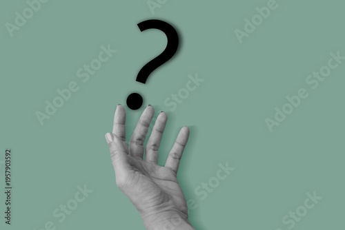 Hand holding yellow question mark on light green background. Art collage digital pop modern art