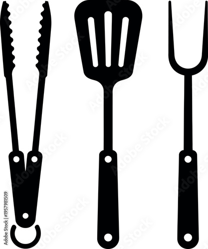 Three essential kitchen utensils: tongs, spatula, and fork.