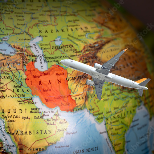 The effects of the Iran war on air transportation. The passenger plane is flying over a map of Iran. Political and economic crisis in the Middle East. Canceled or delayed flights. No people, nobody.
