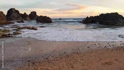 sunset over the rocky beach