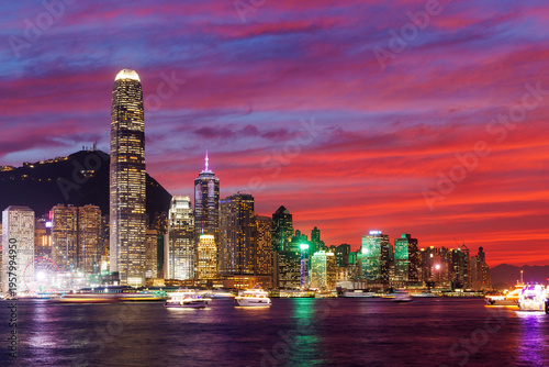 Canvas Print Hong Kong city skyline at sunset with glowing sky and skyscrapers