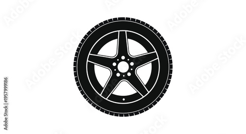Black tire with a five spoke wheel a striking silhouette