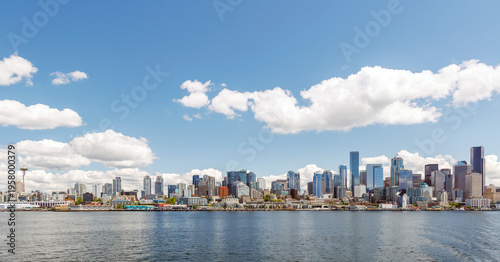 Bright and sunny panoramic view of Seattle skyline from the water