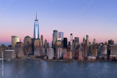 New York City skyscrapers in panoramic landscape. New York skyline with Manhattan Tower panoramic at dusk. NYC aerial panoramic cityscape at dusk. New York City Hudson panoramic skyline at sunset.