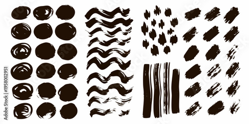 Abstract collection of black brush strokes and painted oval shapes