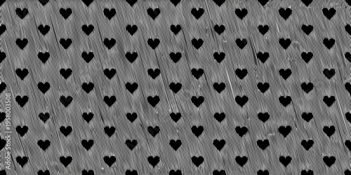 A grayscale pattern of repeating heart shapes covering the entire frame