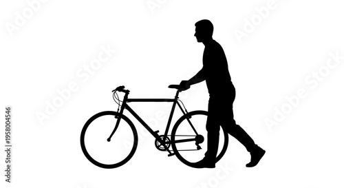 Silhouette of a man walking with his bicycle.