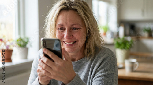 Free Download Mature woman crying with joy while looking at smartphone - GFXLoad