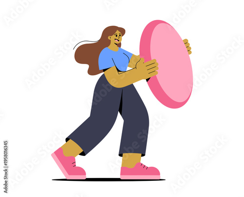 A woman in casual clothing holding a large pink frisbee in a playful and dynamic pose.