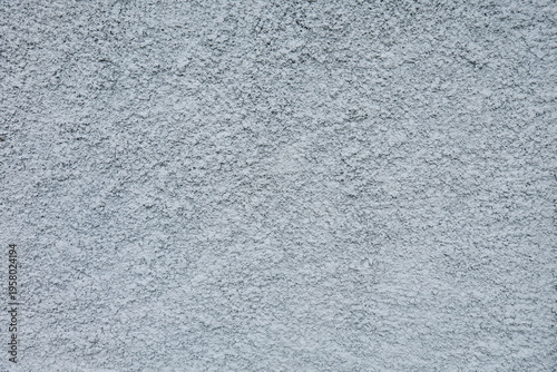 Foto closeup of a rough and grey concrete wall surface showing detailed grainy and po
