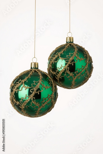 Green Christmas Baubles with Gold Mesh Pattern Hanging on String Isolated on White Background