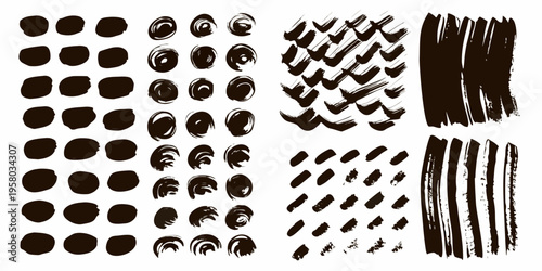 Collection of abstract black brush strokes and paint splatters arranged neatly