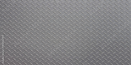A seamless industrial diamond plate and brushed steel metal texture creates a gray metallic surface pattern for construction material backgrounds or silver aluminum sheet wallpaper