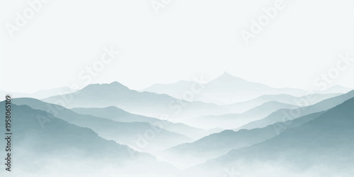 A serene morning landscape view of misty mountain peaks and a forest valley covered in fog under a blue sunset sky with winter clouds