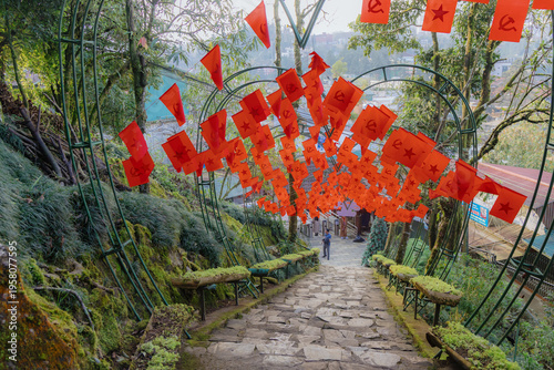 Tableau sur toile A stone path is decorated with red communist flags in Ham Rong Park, Sa Pa, Lao Cai, Vietnam